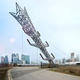 Illustration for article titled This Transmission Tower Sculpture Looks Insanely Precarious